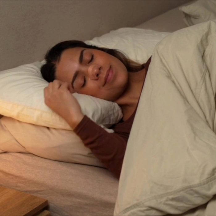 Woman sleeping with a HASLOM Premium nasal strip